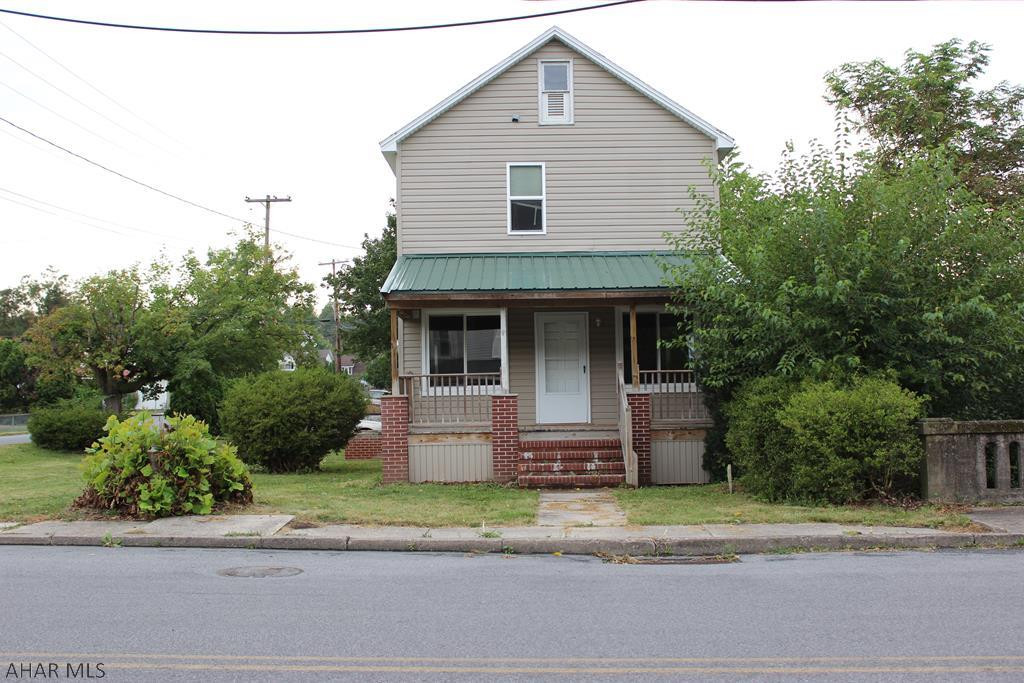 This 3 Bedroom Home, with a Walk Up Attic, and a  Covered Car Port,   Offers an Open Concept on the First Floor for a Very Generous Living Space , and is Conveniently located in Town.