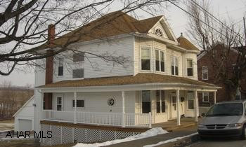 2-story 4 bedroom 1.5 bath home on .6 acre Restored turn of the century 4 bedroom home with newly finished wrap-around porch.  Nice hard wood floors, large rooms with high ceilings, bay windows, and a victorian feel.  New furnace, 2 car garage, with additional off-street parking all located on a large lot in New Paris.