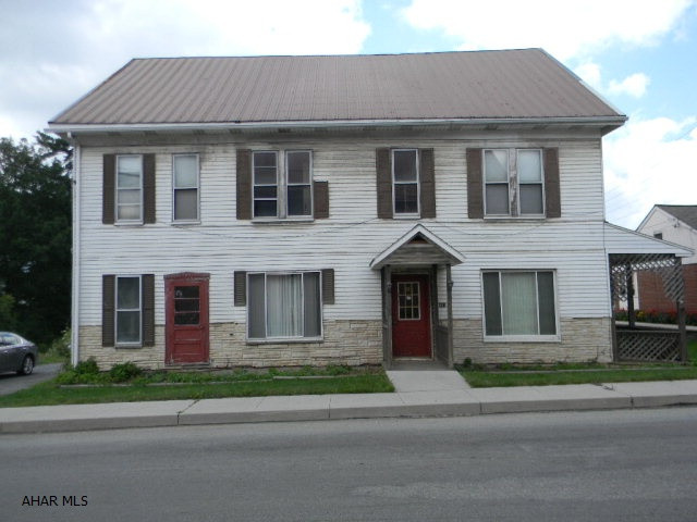 Large 11 room, 3 bath house in Shanksville Borough. Capable of conversion to 3 or more units. Hot water heat is supplied by multi-fuel outdoor furnace. Good investment opportunity. Offered As-Is. Immediately available.
