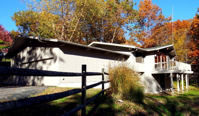 Very nice deck home nestled in the woods. Plenty of light, wooded views. Large deck. Hardwood floors, ceramic tile. 2 private wells. Privacy in a central location.