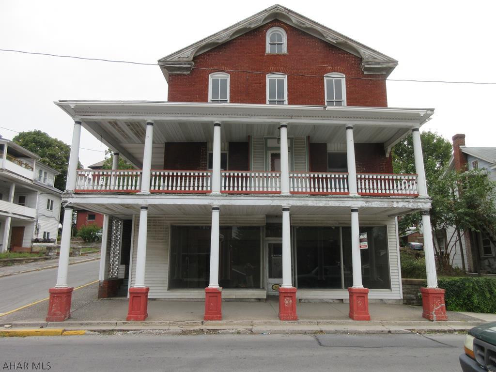 Roaring Spring 2 story building includes storefront and 1 large residential residence that could be converted to 2 or 3 apartment units. Also included is a separate, large concrete block building for many possibilities. No rental histories available. AS-IS sale. Seller will make no repairs.