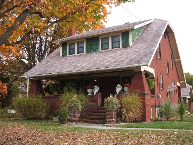 Awesome 2 1/2 story brick home. Large corner lot. Two car brick detached garage. All new vinyl windows throughout. 2 full baths...one located on the first floor. All bedrooms have 2 closets. Large rooms. Original hardwood floors and trim! Huge walk-up attic for tons of storage. Cold Room in basement...fully shelved for canning or additional storage. The L Room is adorable. Don't miss it! Main bath is so retro...subway tile and laundry chute. Furnace is 3 years old.