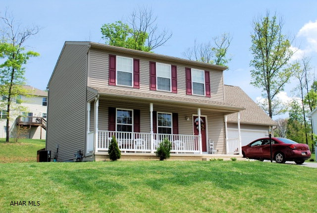 Beautiful two story home with oak kitchen, hardwood entry, first floor laundry, 2 car garage and rear deck.