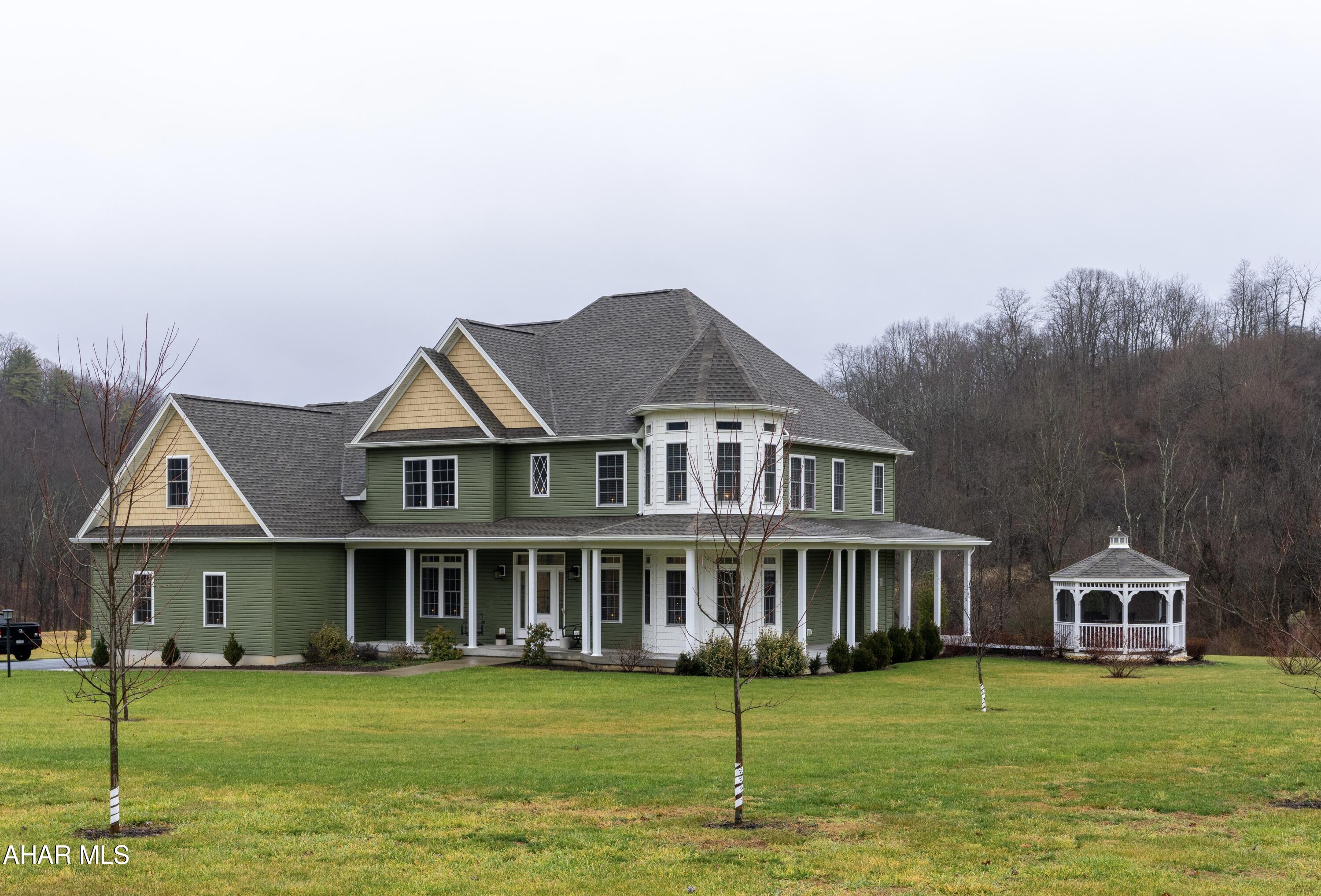 Stunning custom built home, on 2.69, acre in Scotch Valley.  This 2018 home was built with every detail in mind.  See the Beautiful  Hickory Hardwood flooring throughout the home. Plus, custom blinds, custom kitchen Cabinets, Granite Countertops, Wine Refrigerator, floor to ceiling Stone Fireplace and 2 Bosch high efficiency heat pumps  to keep you warm in the winter and cool in the Summer.   The 1st floor features an open floor plan,  with a formal dining room, first floor bedroom, 3/4 bath, laundry room and  private study  with  French Doors ( the glassed Turret Room.)  The 2nd floor offers 2 large bedrooms with full bath , recreation room and impressive master Suite ( With a Huge walk-in closet and 6 ft jetted tub. There are 2 oversized heated garages and one detached garage, connected with a long, wide driveway. There is a wrap around covered porch that extends from the front of the house to the back of the house. Along with a new screened-in Gazebo that was added for your enjoyment both day and night.  New Roof installed in 2023. Plus, new extensive landscaping; trees, shrubs etc. Ask for your private showing today!