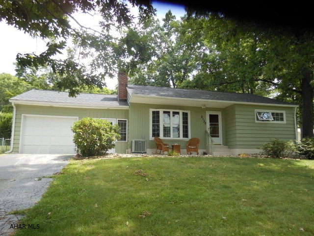 This is a lovely ranch home with updated kitchen, beautiful new baths, newly finished family room  with gas fireplace, hardwood floors, pretty natural stone wall with built in bookcases and gas fireplace in the living room .Relaxing back deck and large fenced  yard too ! Newer gas furnace and central air. Stay out of the weather going from the attached garage to the nicely finished breezeway...also serves as more living space and opens to front and back yards.