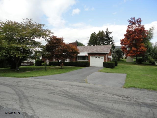Nice Brick Ranch, room with fireplace in basement, hardwood floors, large lot, stove top, lots of potential, workshop in basement.