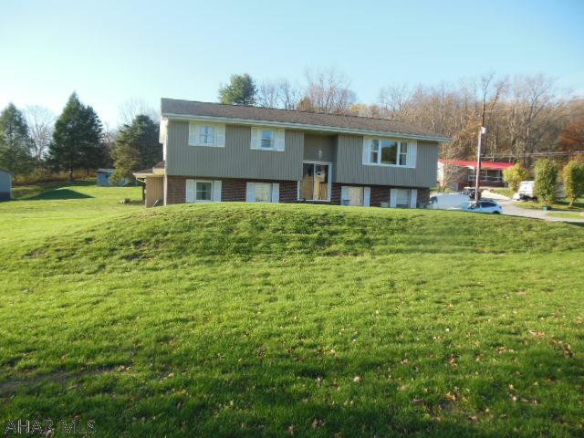 Exceptiional, move in condition. Bi-level in Bellwood, on 0.7 acres of level, manicured lawn w/white cement driveway. 4 BR, 2 BA, 2 single car garages attached. OFA w/central air, beautiful HW floors and includes appliances. Oak kitchen w/accent lighting. Exceptionally beautiful!