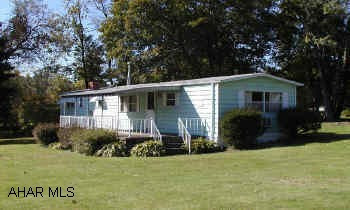 Irregular lot 156 x 141 x 145 x 200 Nice 2 bedroom mobile home on a large lot.  Well and City sewer, Natural gas.  Irregular lot 156 x 141 x 145 x 200
