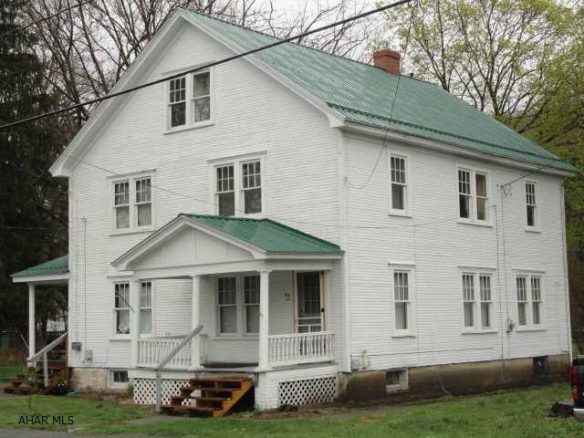 Stately duplex located in Claysburg. Great investment/rental property or live on one side & rent the other. Even better create a beautiful large single family dwelling. Living room, dining room, kitchen; 1st floor both units. 2 or 3 bedrooms on 2nd floors and bedrooms or storage on 3rd floor. Newer kitchens and bathrooms. New roof. All this on a large, double, flat lot. This is a property with many options and well worth seeing. Don't miss out!!! Note:Selling agent is related to seller...