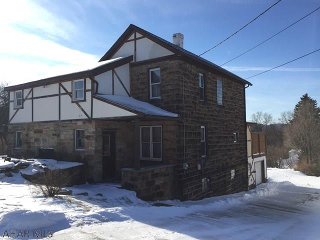 Agent Owned.  Solid home in a quiet setting.  Beautiful wood trim and stone exterior make this home warm and unique.  Back deck overlooks the valley.  Walkout basement provides access to the garage for easy, convenient living.  Formal dining room with wood accents.  New carpet throughout.  Come see this beautiful home.