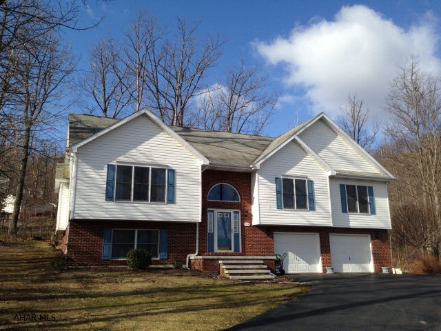 Absolutely immaculate home on large wooded corner lot. oversized bi-level. lots of light. vaulted ceilings . large eat-in kitchen. many updates. new furnace, new hot water tank. kitchen has new counter tops,tile backsplashes hardwood,and floors. All bathrooms are updated also. master has walk in shower. two decks..one off of the dining room, and one from the master bedroom. this is really a great one...dont miss it...priced to sell.....