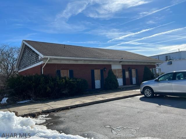 Solid brick one-story building for sale with large canopy with drive through. This well constructed building sits on a large lot in Eldorado section of Altoona. This building was previously a bank and still has vault and safety deposit boxes.
