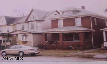 Nice, big brick with newer roof and furnace.  Hardwood floors, natural wood with updated wiring.