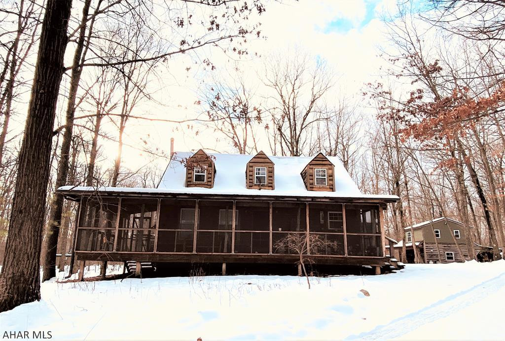 Abundantly private home located on a large wooded lot.  House features all of the amenities needed for full time residence and all of the space for recreational pursuits.  A lengthy front porch gives a pleasurable place to enjoy the property.  Main house is 2 bed; 1.5bath; Guest house has an additional 1 bed and 1 bath.  Plenty of flat space for expansion with mature timber throughout the property.  Guest house with carport adds additional living space with a living room and kitchenette and a upstairs bedroom and full bath for more accommodations.  Property is easily accessed from local highways and one can quickly be back to town or other locales.