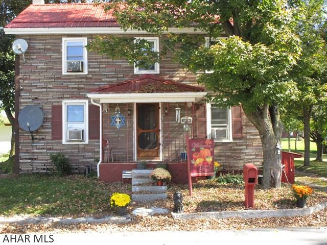 Come see this affordable home that has many updates!  A new metal roof was added in 2014 and a new well and furnace in 2005. The home has a generator and a security system that requires no monthly fee. Almost a full tank of oil is available for the coming winter months.The kitchen is large and open with a lot of cabinet space and hardwood laminate flooring. A movable island provides additional storage and seating. The large living room has a textured ceiling and a nice wooden banister leading up to the second floor. Enjoy grilling during the spring and summer months with a built-in grill on the patio. The back yard has matured peach, plum and apple trees and an area for a big garden with a water system already in place to keep your garden going in the hot weather! Give me a call!