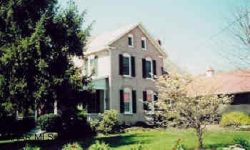 4 bedroom brick colonial on 17 acres. Totally restored. Inground pool. Beautiful grounds. Large bank barn.