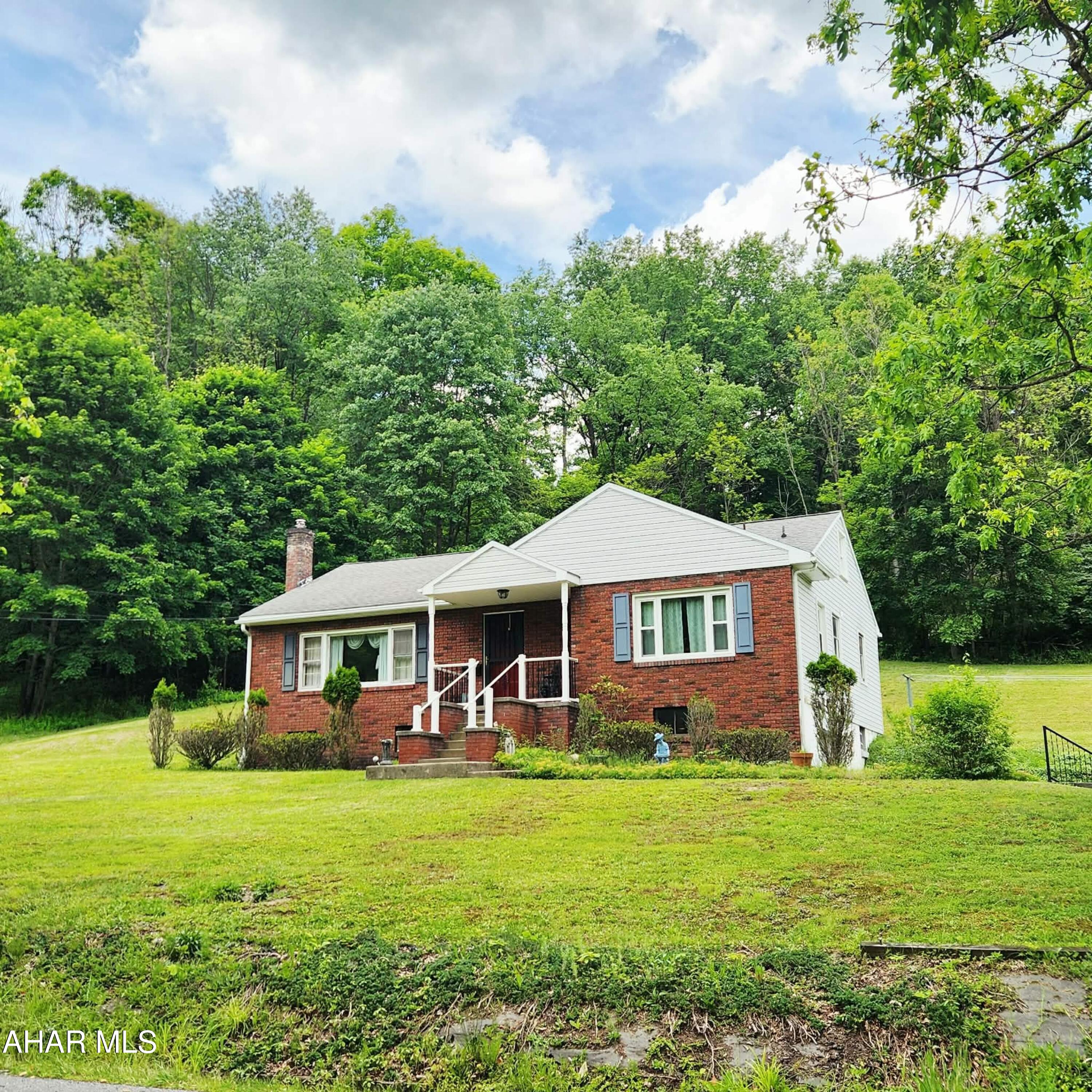 Charming ranch home in Hollidaysburg School District on just over two acres. This one-story home offers a living room, an eat-in kitchen, a full bathroom with laundry, and three bedrooms on the main floor. The upper level is a bonus room that was used as a 4th bedroom. Beautiful hardwood flooring throughout that can be refinished adds original charm! The unfinished basement offers ample storage and a 1-car garage. The sloping and wooded acreage offers lots of outside space to meet your needs. Call listing agent for your tour.