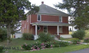 From Bedford, 220N.  Left onto 869.  At stop sign, make a right toward Osterburg.  Follow 869 into Osterburg, straight onto Oster Street.  House is on the left, sign in yard.   Lovely and spacious 2-story brick home on quiet street.  All new windows and spouting.  Hardwood floors, pocket doors, first floor laundry and more!