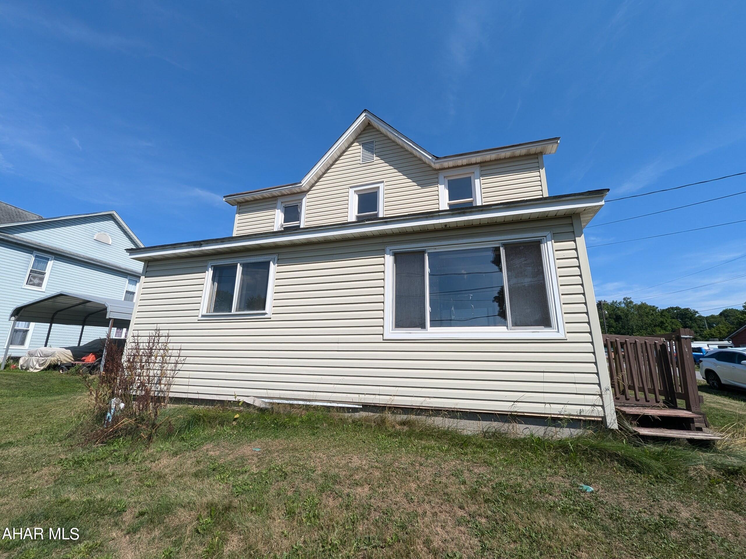 Madrea 2 story vinyl home is perfect for investors or handy persons! Futures large eat-in oak kitchen w/ laminate floors, formal living room and dining room, first floor laundry (needs TLC). 3 bedrooms and bath upstairs. Nice level lot and covered side porch. AS-IS sale - seller will make no repairs.