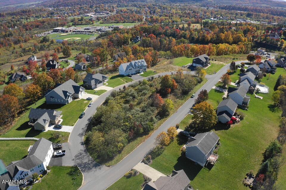 Explore the opportunity to own the largest buildable lot in the sought-after Fox Hollow development. This Approximate 1-acre flat lot offers stunning views of Hollidaysburg, providing a perfect setting for your future home. With all essential utilities available (gas, water, electric, and cable), this lot is ready for construction and designed for convenience.

Situated in an established neighborhood, this property combines great views and accessibility to local amenities, making it an ideal choice for those seeking a prime location. The lot's generous size allows for a spacious home and ample outdoor space to enjoy the scenic surroundings.

Take advantage of this rare opportunity to create your ideal residence in one of the most desirable areas in Fox Hollow.