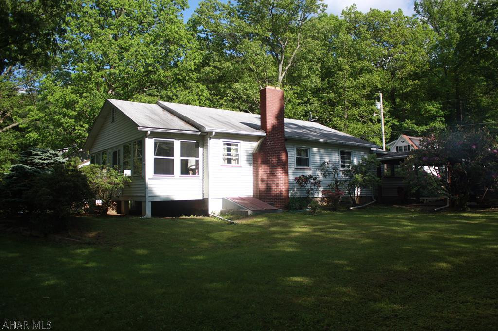 This property is located on Cypher Road by the Juniata River.  Get away for a weekend or use it as your home.  All furnishings in home are included in the sale of this property.  There is a wood burning fireplace in the living room, large enclosed Sunroom for extra guest, an outside patio with a brick gill area for cook outs.  Property is close to Raystown Lake, Bike Trail, Fish from the front yard or through your kayak  in  and have some fun.  Options are endless.  There is a full basement, vinyl windows throughout, large rooms, Breakfast nook off the Kitchen, One garage for your car and one for the golf cart.  Schedule a showing today and see it all for yourself.  Call listing agent for a personal tour.
