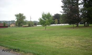 Large level building lot in Pleasant Valley. All utilities available.