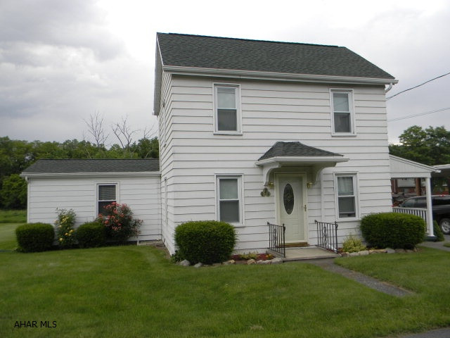 This house is immaculate, super well maintained! Recent updates include; New kitchen with oak Kraftmade cabinets, cer. tile backsplash, stainless appliances, new bath, new shingle roof, carpet, vinyl & Pergo floors, thermo pane windows, doors & paint. First floor master bed, first floor laundry, gas h.w. heat & covered porches. Double lot, convenient to everything & oversized 1-car garage.