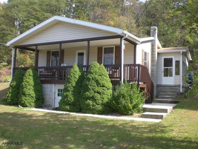 Well maintained one-story home w/ vinyl siding, thermo pane windows, and shingle roof.  The interior offers a living room, small office, kitchen w/ eat-in area, two bedrooms and a full bathroom.  Oil forced air heat, partially finished basement, macadam driveway, enclosed sun porch and front covered porch.  Nice view of the surrounding countryside, private setting, close to Yellow Creek and the Hopewell Sportsman Association.  A really nice home and setting w/ all appliances included.