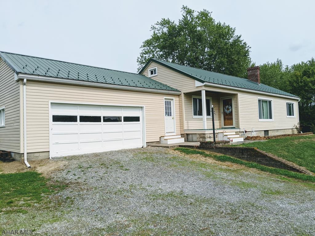 Beautiful 5 acres in Antis Township, Bellwood School District with a one story home. 3 bedroom, 1 bath, hardwood floors, walk up attic the length of the whole house, large open walkout basement, 2 car garage w/enclosed breezeway to house, additional detached garage for storage, large barn. Great location, minutes to downtown Bellwood, I-99 Highway, UPMC Altoona, PSU Altoona. This property is just waiting for you to make it your own! Schedule your showing today!
