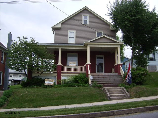 Step Back In Time - And Enjoy The Charm Of This History Rich Home - LR, DR, Kit., 3 BR, 1 BA - Lg. Wraparound Porch - Deck - Garden - Detached 1+ Car Garage - Nicely Landscaped - All But 2 Windows Replaced - Garage New 1994 - Built In Big Screen TV In LR - Stays W/Property.