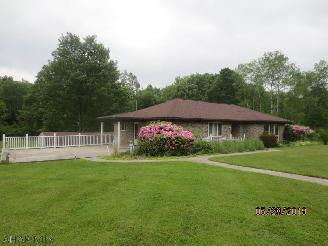 well built brick ranch 3 bedroom home with updated custom kitchen with basement and detached garages sitting on beautiful 2.92 acres. Partially finished basement with pot belly stove. Flood maps are vague but the some of the land is in the flood zone and possibly the house is in the flood zone.