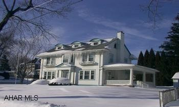Fabulous 5 bedroom 3 1/2 bath home on giant corner lot, 4000 square feet.  Completely renovated.  Beautiful hardwood floors and built-ins throughout.  Master bedroom suite with jacuzzi tub, grand foyer with two staircases.  Pocket doors, river rock fireplace, ceramic tile, first floor laundry, french doors to lovely side porches.  One of a kind home...a must see!