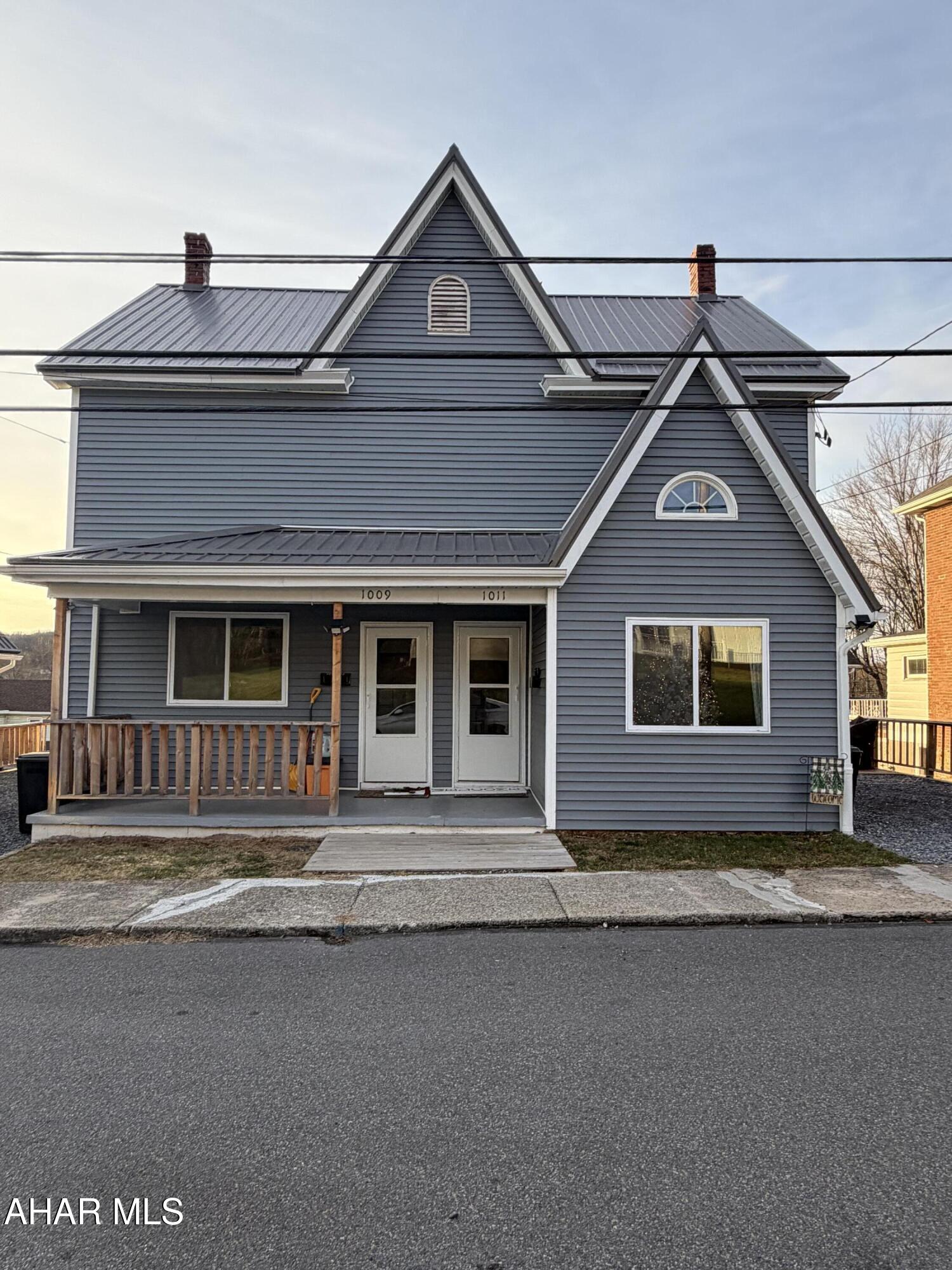 Welcome to this incredible, turn-key investment opportunity or ideal owner-occupied home in Lilly PA!  This fully renovated duplex offers the unique chance for a buyer to live in one immaculate, vacant unit while instantly generating income from the occupied second unit. Every detail has been meticulously updated, offering modern comfort and peace of mind for years to come. Former owner installed the metal roof, current owner installed new siding, soffit and facia, windows, basement door and screen doors, redid parking areas and steps to the rear of the property making the exterior maintenance free for years to come.  Enjoy brand new appliances, new furnaces, new oil tanks, and a new hot water heater in the left unit, ensuring low maintenance and energy efficiency.  The second-floor in both units has been thoughtfully reconfigured to eliminate captive bedrooms, creating a more functional and desirable living space. Beautiful new kitchens and new flooring throughout give it a modern feel.  A large, full attic is accessible from the right unit, offering abundant storage space. Tenants can pay all utilities if you choose... This property is a rare find, combining the benefits of a house-hacking opportunity with the quality of a new home. Don't miss out on this stunning, low-maintenance property!  Buyer to verify all measurements.