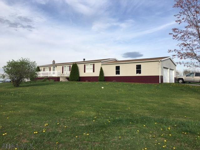 3 bedroom, 2 full bath doublewide home on full 28'x60' foundation with large 28'x32' 2 car garage. Country setting on 1.5 acres with beautiful views. Includes hot tub and high end pool table. Drive is shared with neighboring farmer only to access fields behind home. Well maintained and move-in ready!