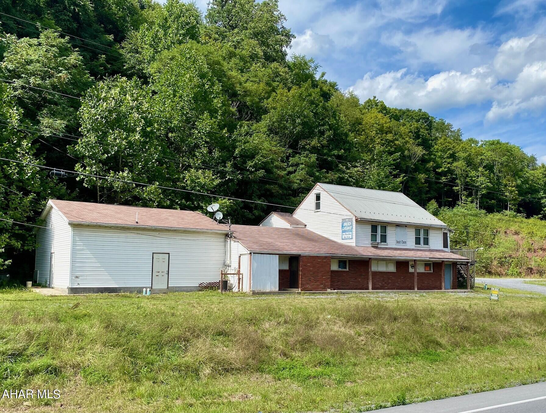 Explore this Unique River Front property.  Previously a tavern/restaurant. This property has so much potential!!  The main floor has a kitchen, 2 large restrooms, game room, lounge, open area, bar and cooler. The second floor residence/apartment or 2 bedrooms, kitchenette, and bathroom. 
Large parking lot.  River front/river access to the  branch of the Juniata River for all your recreational needs.  Home or Business its all here!!  Call for your tour today!!  AS IS WHERE IS