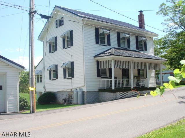 Meticulously cared for home. This lovely property has been gently lived in and so very well maintained.  This country home boasts 3 bedrooms, 1.5 bathrooms, 1st floor laundry facilities, metal roof in 2017, 2 car garage, all on 0.53 acre lot (recently surveyed in 2018).  Enjoy the front or back covered porches on a summer's day or the enclosed porch when there is a chill in the air.  A bright and cheery kitchen with ample cabinets and counter space.  Built-in shelving at the entry way to the basement for additional storage.  Don't miss this little gem in the quiet country side of Warriors Mark.