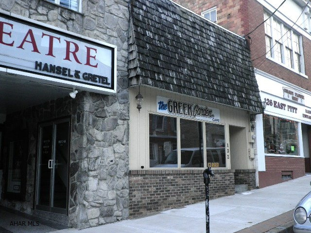 Former Greek Garden Cafe. Request list of items to be included. 200 AMP Elect. Service. Natural Gas for Cooking, Ansul Fire system- kitchen, Central air, Part slab/part crwl foundation, Elect. water heater.  The PENNY SCALES is NOT included; and, some personal property/items will NOT be included.  NOTE:  STEPS WHICH LEAD UP TO KITCHEN LOCATED IN BACK PART OF BLDG. - TOP STEP IS LOOSE - PLEASE BE CAREFUL.