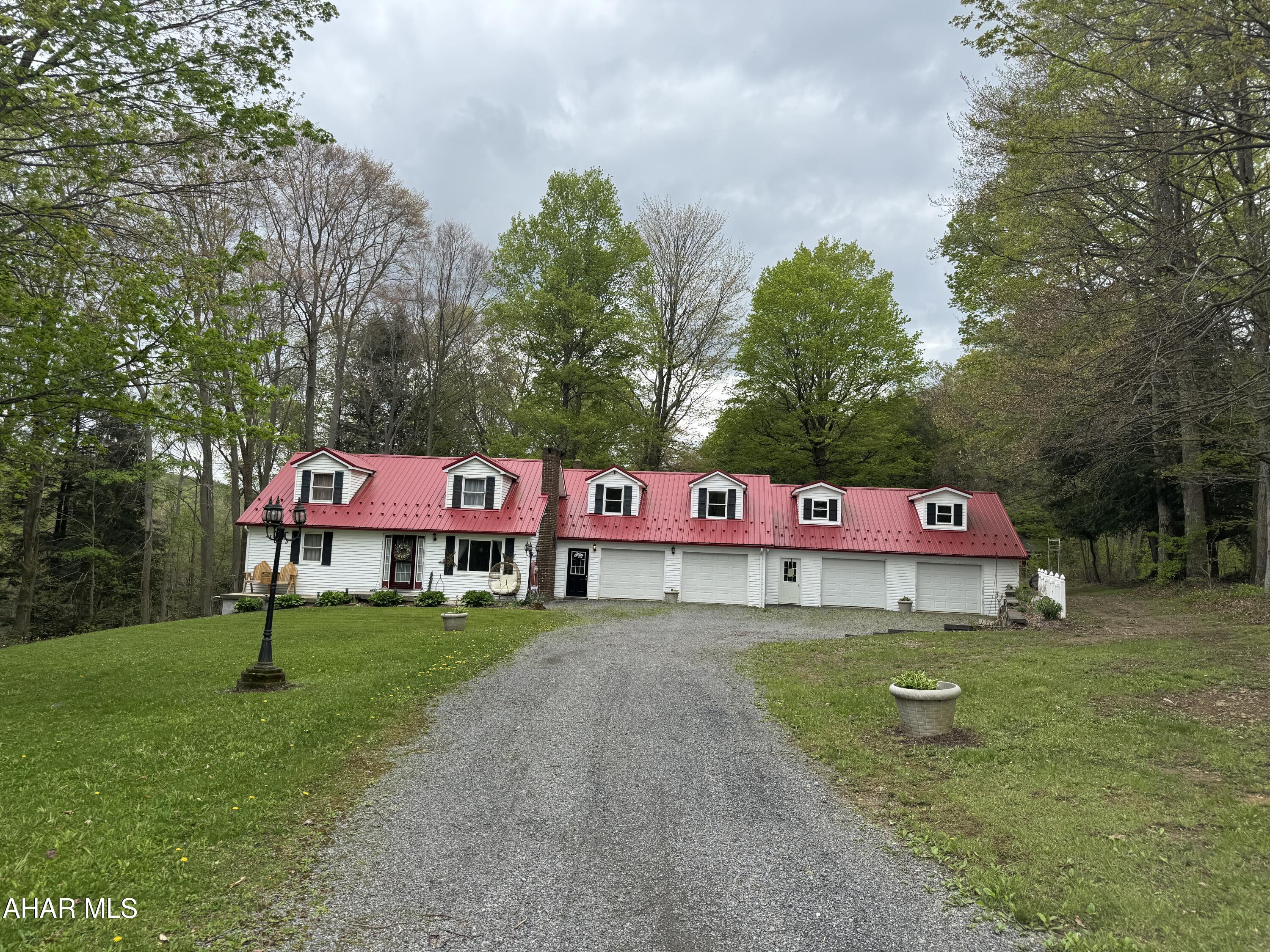 Great location off Lemon Drop Road this Cape Cod boasts 4 bedrooms, 2.5 baths, living room with fireplace, equipped kitchen, dinin,g area, full finished basement includes family room with  woodburner insert in fireplace, exercise room or office, laundry room and half bath. Attached 4 car garage. 2 stall barn. Great home in a nice country location!
