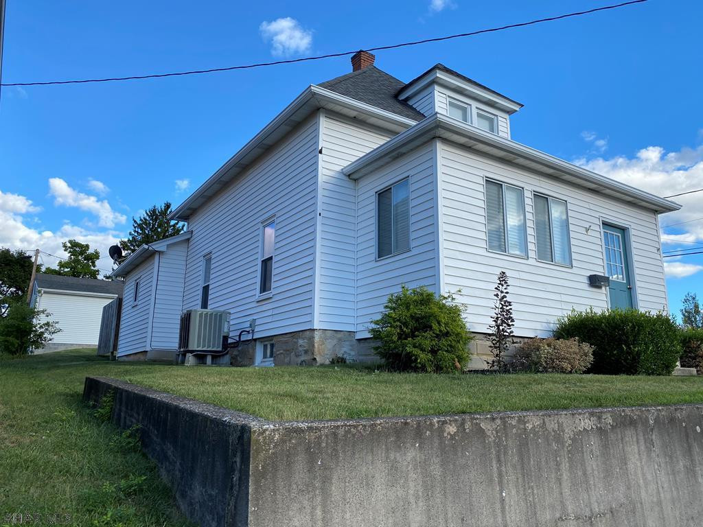 Very well kept 2 Story on a corner lot in Roaring Spring. Main floor Bedroom, 1/2 bath/Laundry room combo.  Large Living and Dinning room.  Second story provides 2 additional Bedrooms and a Full Bath.   Full unfinished basement.   Home also has a 2 Car garage with extra storage area and additional off street parking.   This home is move in ready!