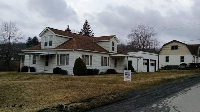 2 car detached garage 28X30, 1 1/2 story, 4 BR, 1.5 bath home on spacious lot, 200X195.  Commercially viable property.