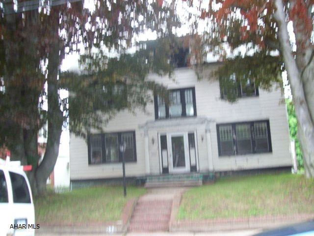 This old beauty needs some major fix-up & updating, but could be oh-so-grand. Lovely hardwood floors, nice archetectural details & french doors give this 4 bedroom home a welcoming graciousness of days gone by.