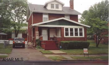 Solid, four bedroom brick home in Calvert Hills, with a brick two car garage.  First floor bedroom with full bath.