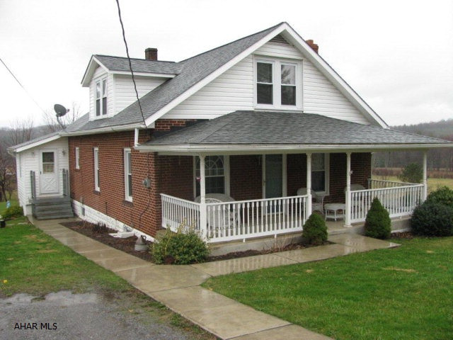 Charmimg Brick Cape on 1.5 acres in Antis Twp, Bellwood Schools!, 2 car detached garage, LR, DR, Large EIK w/oak cabinets & appliances, 4 BR, 1.5 Bath, oversized 2 car detached garage, combo wood or oil furnace. $3000 carpet allowance