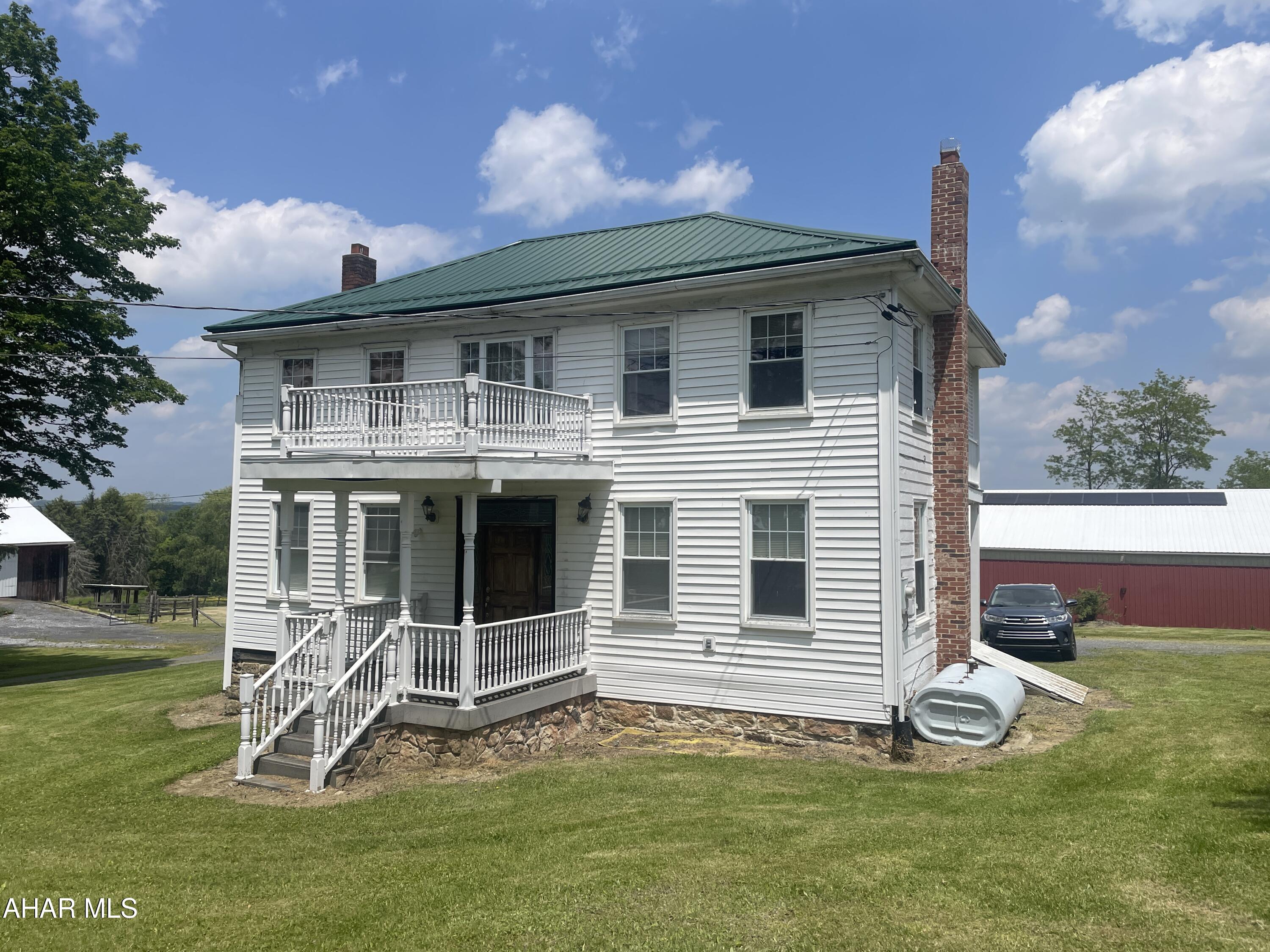 Classic farmhouse on 3.5 acres. 60x100 riding barn, 40x80 bank barn and 30x40 detached metal garage. Pasture area. 1.5 miles from Cresson on Old 22.