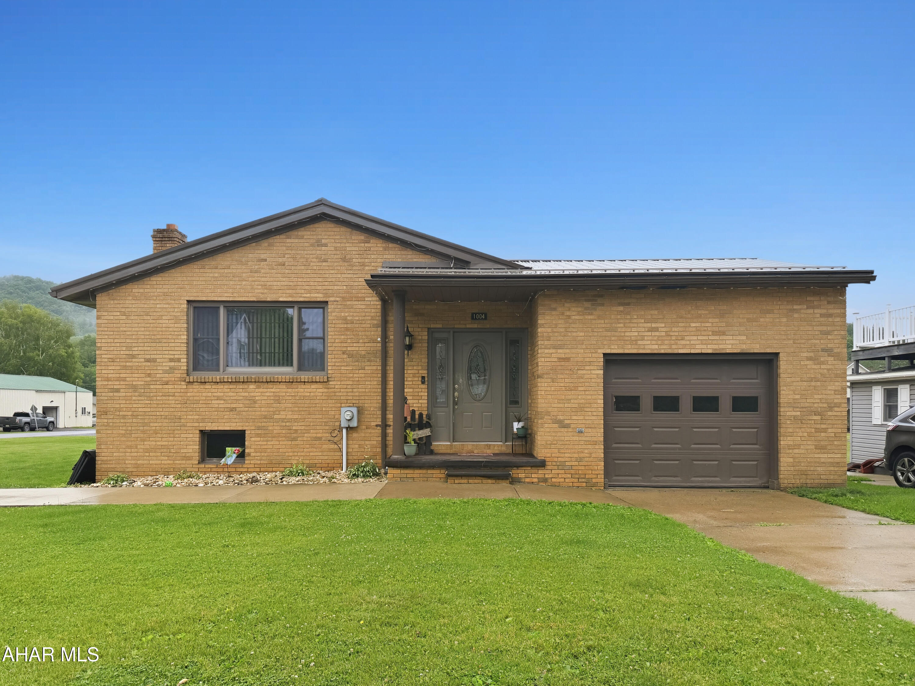 Welcome to 1004 Crawford Avenue in the Northern Cambria Borough! This beautifully updated all-brick ranch sits on a spacious double corner lot and offers the perfect blend of comfort, style, and functionality. The main level features a welcoming foyer, a bright and inviting living room filled with natural light, a dedicated dining area, an updated kitchen complete with an island, three generously sized bedrooms, and a beautifully renovated full bathroom. The finished lower level provides an abundance of additional living space, including a large family room with an included pool table, two versatile bonus rooms ideal for a home office, gym, or guest space, a full bathroom, laundry area, and mechanical room. Outside, you'll appreciate the extra space afforded by the double lot, along with an attached one-car garage, ample off-street parking, a storage shed, a covered rear patio perfect for relaxing or entertaining, and a newer metal roof for added peace of mind. This move-in ready home has been meticulously maintained and offers exceptional value in a desirable location. Schedule your private showing today!