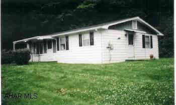 Well maintained home on over half acre. Large yard, surrounded by woods. Great starter home.  Nice location, five minutes to town. Hardwood floors, nice lot.
