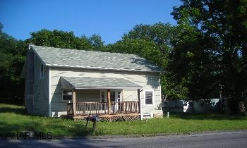 Double lot, vinyl sided, covered front porch, nice size rooms. Needs some work. Convenient location. Very nice buy!