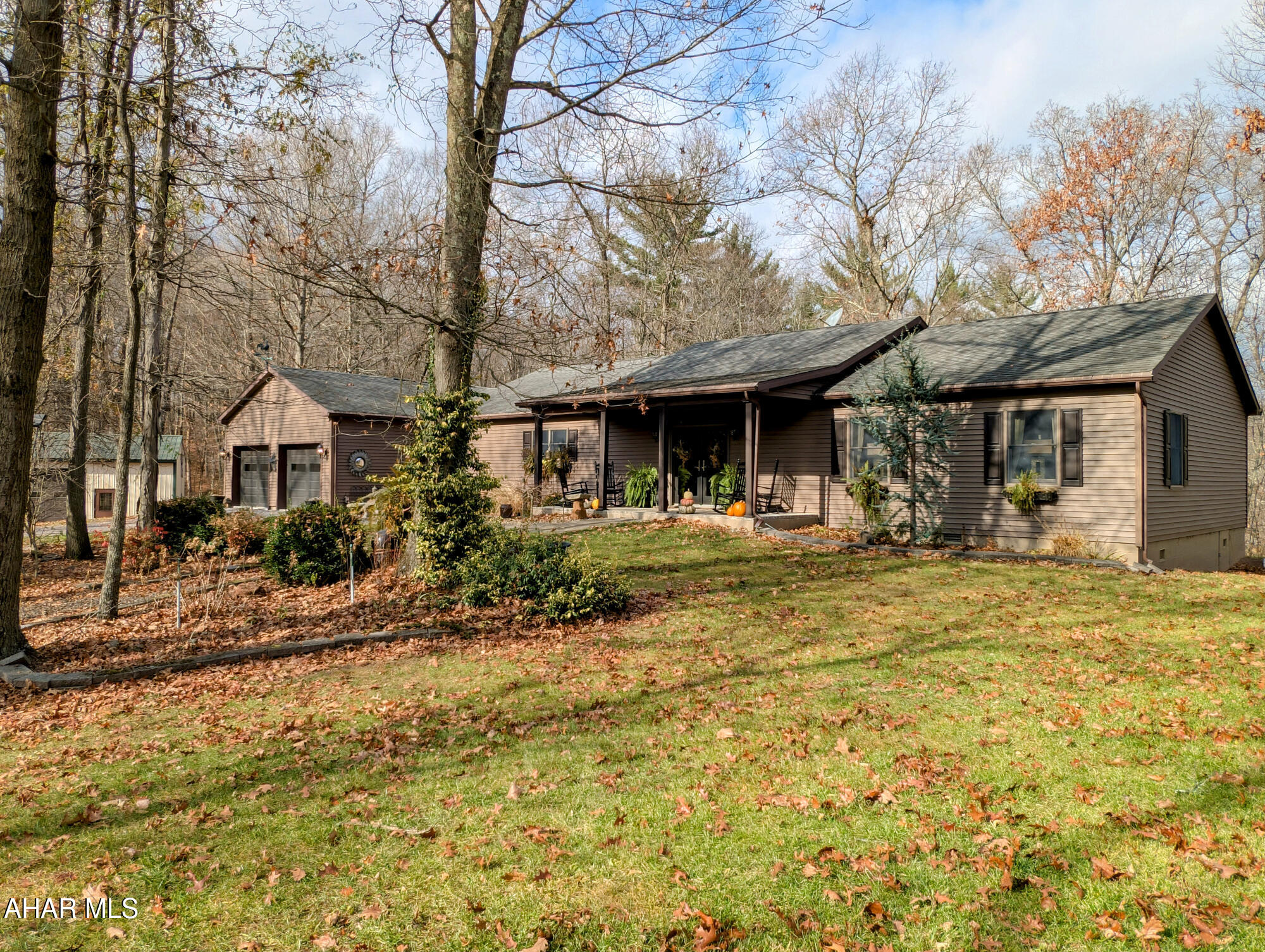 Astounding and Amazing, two words to describe this Beautiful home. One level living, open concept gourmet kitchen with large walk-in pantry, dining area, living room with inviting gas fireplace. Primary Bedroom is spacious with its own full bathroom, complete with shower and soaking tub. A fantastic walk-in closet which even has chandeliers. Head back the hallway from the kitchen and find two other nice size bedrooms, large laundry room, washer/dryer included and has plenty of workspace. Heat is geothermal and home also has central air.  Walk out the French doors to a covered deck that offers space for ultimate relaxation , and an even larger open deck space. Attached two car garage , has a 220 line for charging your hybrid. Sweet potting shed, wisteria covered gazebo with swings, front porch with comfy rockers and a koi pond which homes lots of Koi.  Three bay detached garage with a fourth bay area to park your RV or Boat. Don't miss the letter from the owner on the counter. This home has it ALL!