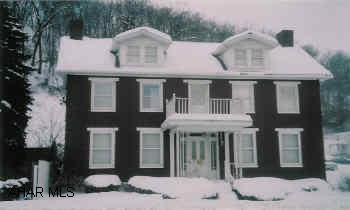 2-story four bedroom brick home in Everett. Detached garage. Being sold as-is.