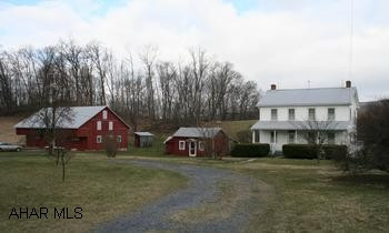 Beautiful farmette on 16.07 acres! Completely renovated 1875 2-story house plus summer house used as guest house. Barn and several outbuildings. Beautiful farmette on 16.07 acres! Completely renovated 1875 2-story house; 4BR/2BA; eat-in kitchen with breakfast nook, dining room, spacious living room with high ceiling, window seat and french doors that open to deck, central air, attic has pine plank floors.  Summer house used as guest house has open floor plan, loft, bath, wood stove, electric heat, pine floors. Barn and several outbuildings. Open rolling fields and wooded acreage. Perenial gardens and grape vines. Escape the everyday hassles and enjoy the tranquility  and mountain ambiance!